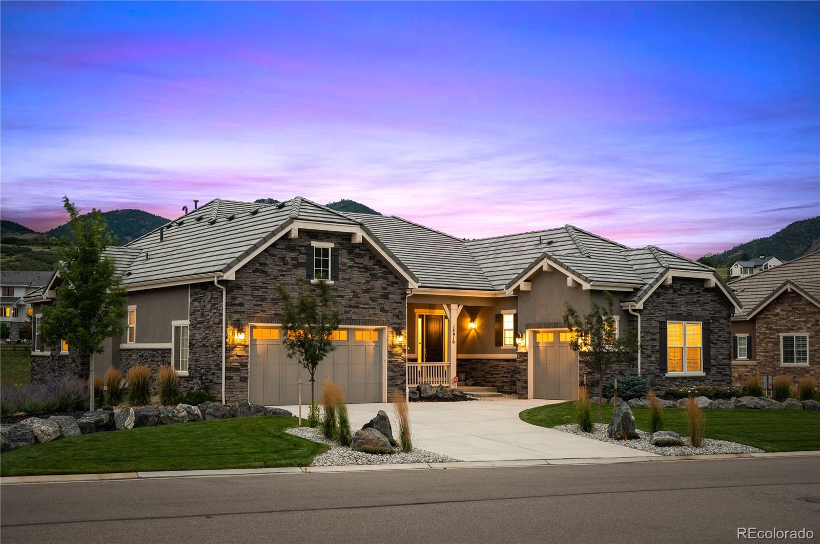 14916 Lyons Ridge Drive Morrison, CO 80465 - Photo 1 of 29 a front view of a house with a yard