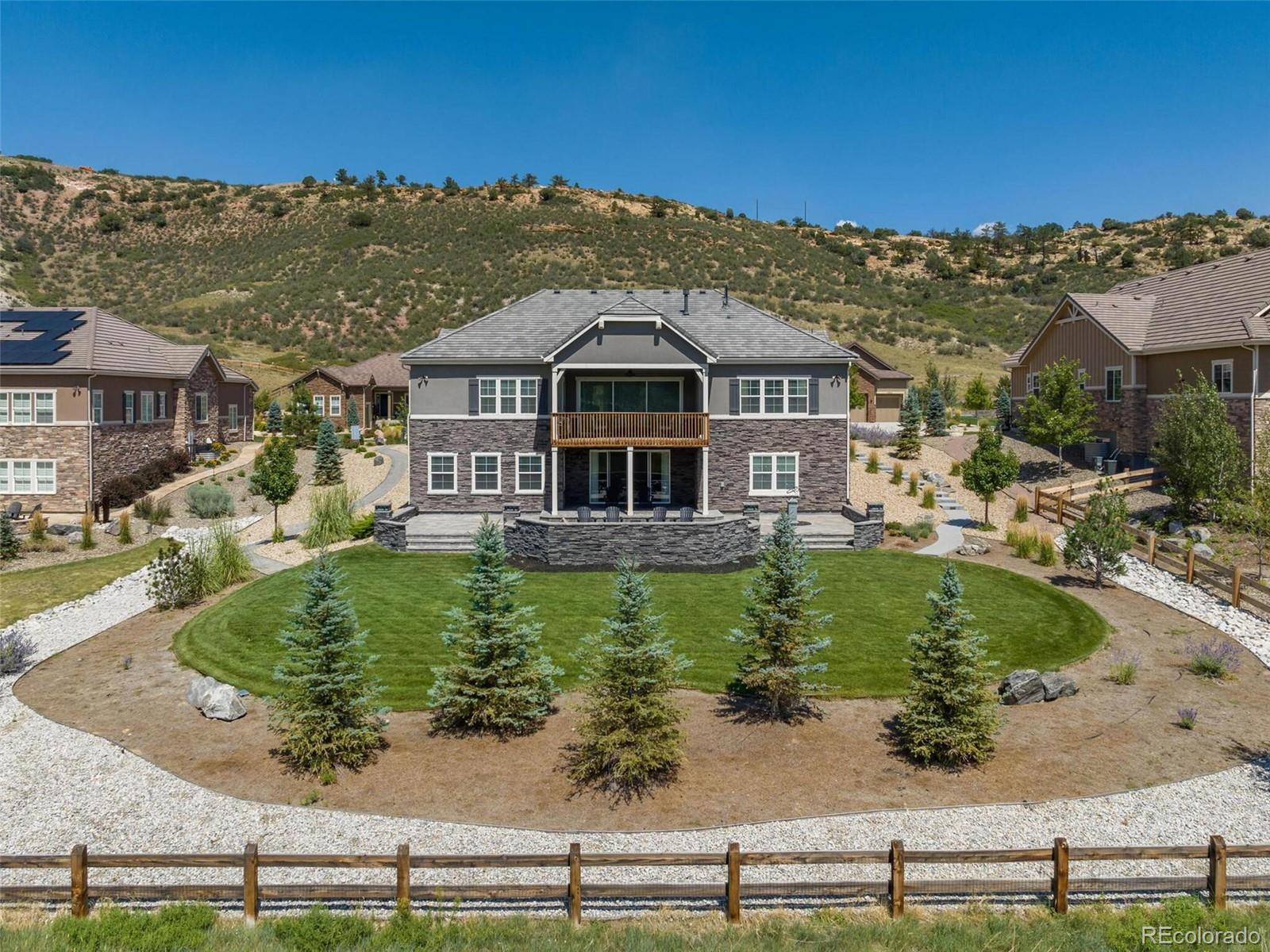 14916 Lyons Ridge Drive Morrison, CO 80465 - Photo 26 of 29 a front view of a house with a yard