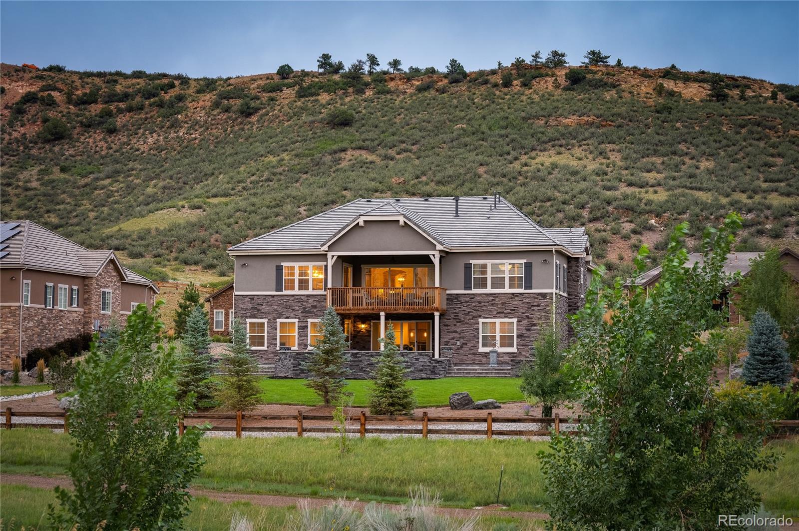 14916 Lyons Ridge Drive Morrison, CO 80465 - Photo 27 of 29 a front view of a house with a yard