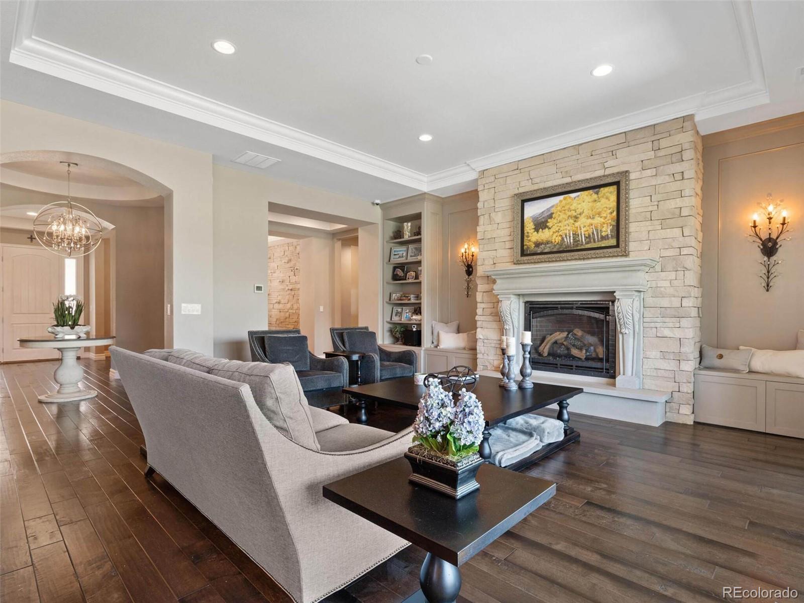 14916 Lyons Ridge Drive Morrison, CO 80465 - Photo 4 of 29 a living room with furniture and a fireplace