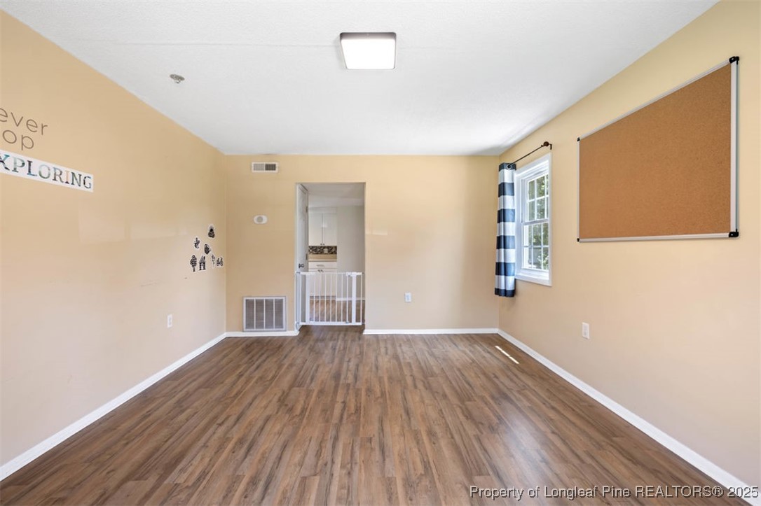 2040 Page Road Stedman, NC 28391 - Photo 11 of 33 a view of empty room with wooden floor