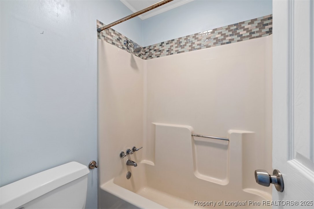 2040 Page Road Stedman, NC 28391 - Photo 16 of 33 a bathroom with a shower and a toilet