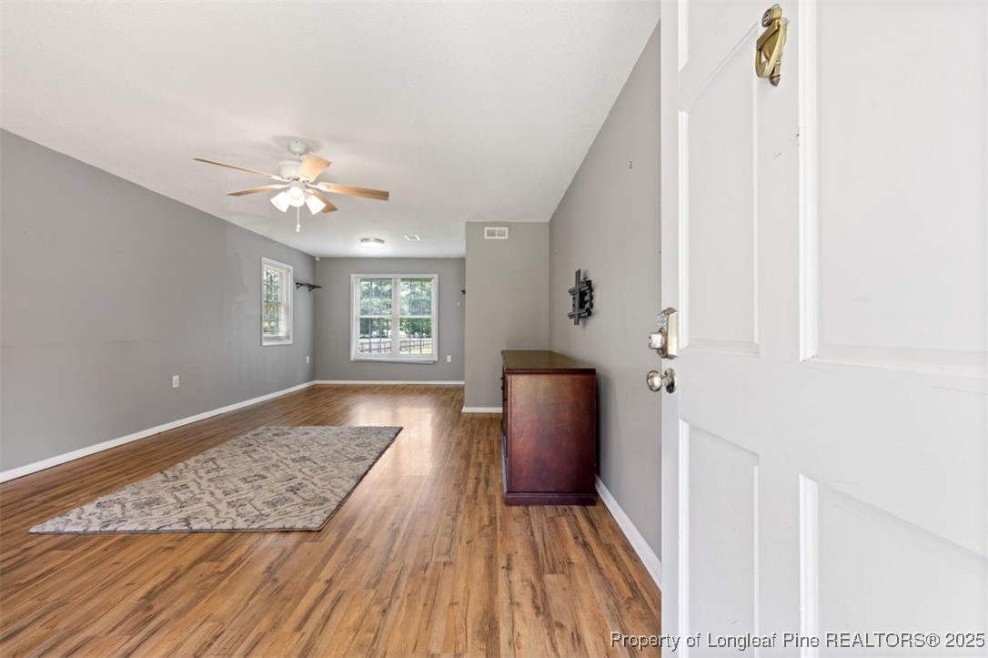 2040 Page Road Stedman, NC 28391 - Photo 2 of 33 a view of an entryway with wooden floor and a workspace