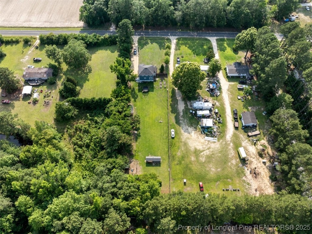 2040 Page Road Stedman, NC 28391 - Photo 33 of 33 an aerial view of residential house with outdoor space and lake view