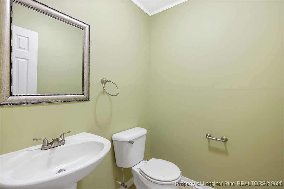 2040 Page Road Stedman, NC 28391 - Photo 9 of 33 a bathroom with a sink mirror and a toilet
