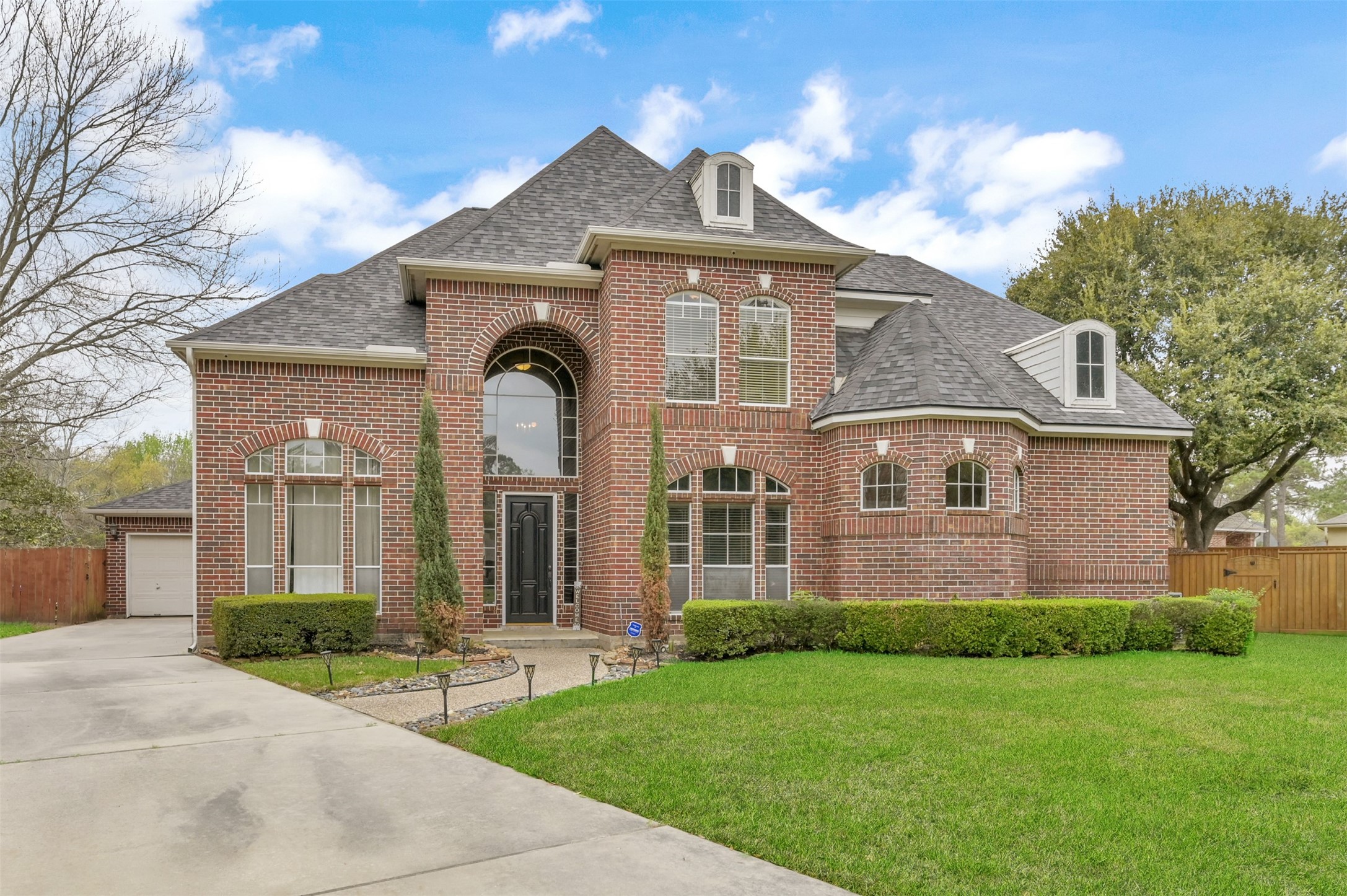 9706 Chipstead Court Spring, TX 77379 - Photo 3 of 44 Your extended driveway leaves plenty of room for your vehicles or for when you have guests over.