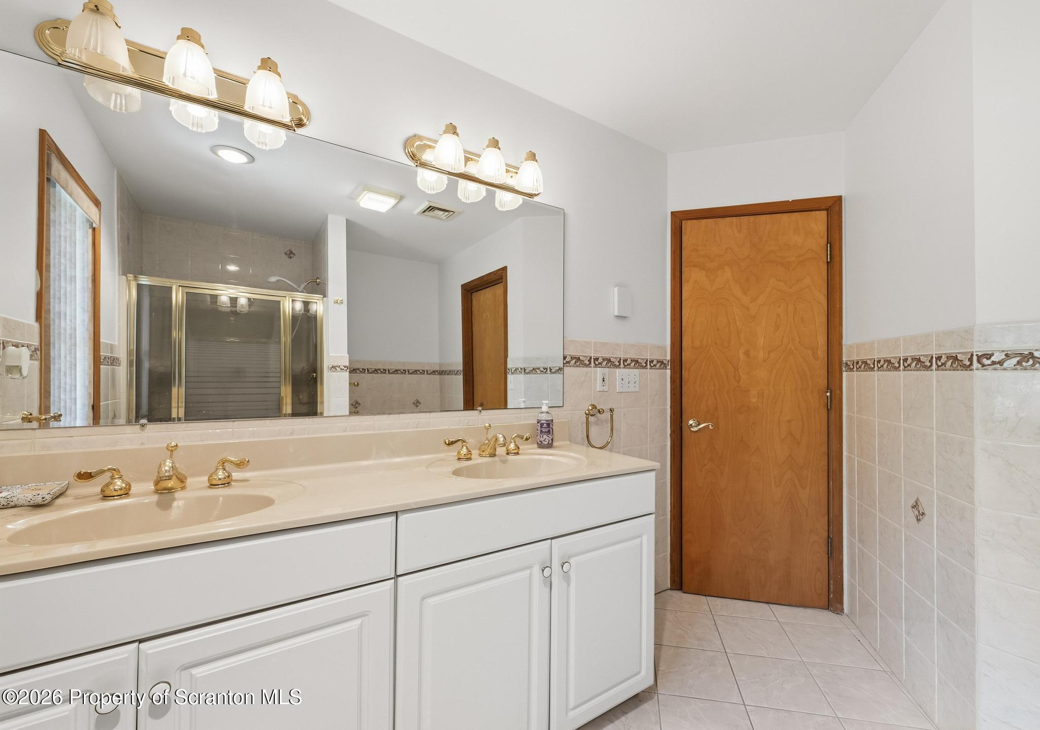 58 Bender Road Gouldsboro, PA 18424 - Photo 31 of 55 a bathroom with a sink vanity and a mirror