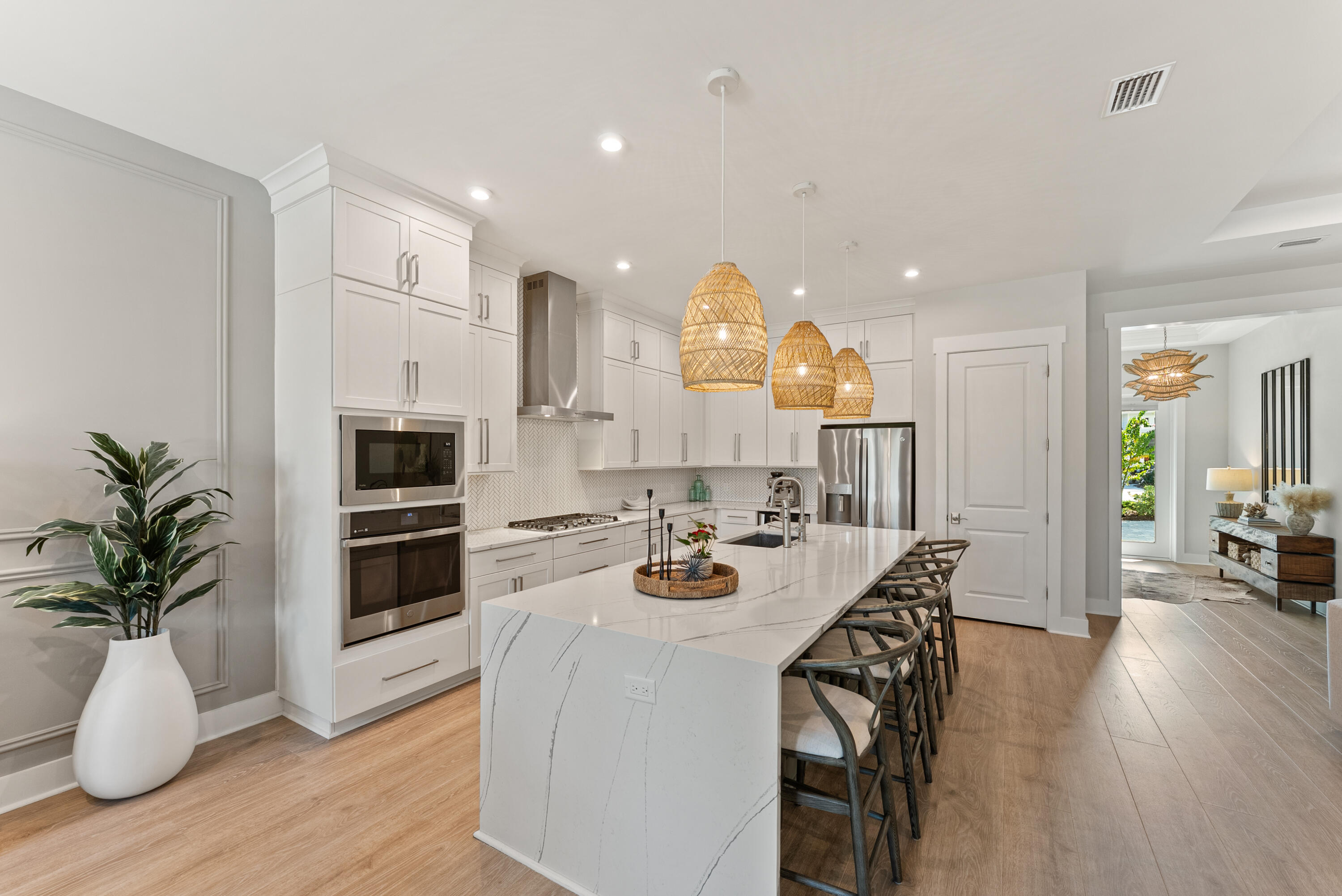 320 West Lafayette Rd Inlet Beach Inlet Beach, FL 32461 - Photo 2 of 90 a kitchen with stainless steel appliances a dining table chairs stove and white cabinets