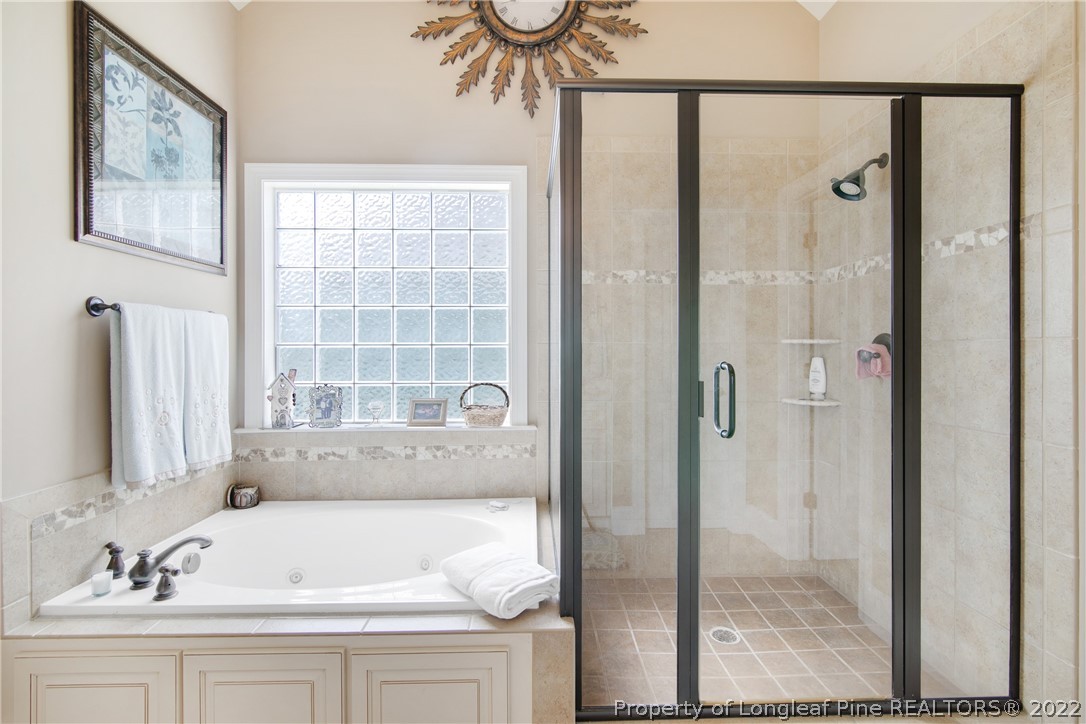 254 Falling Water Road Spring Lake, NC 28390 - Photo 21 of 35 a bathroom with a sink and a bathtub