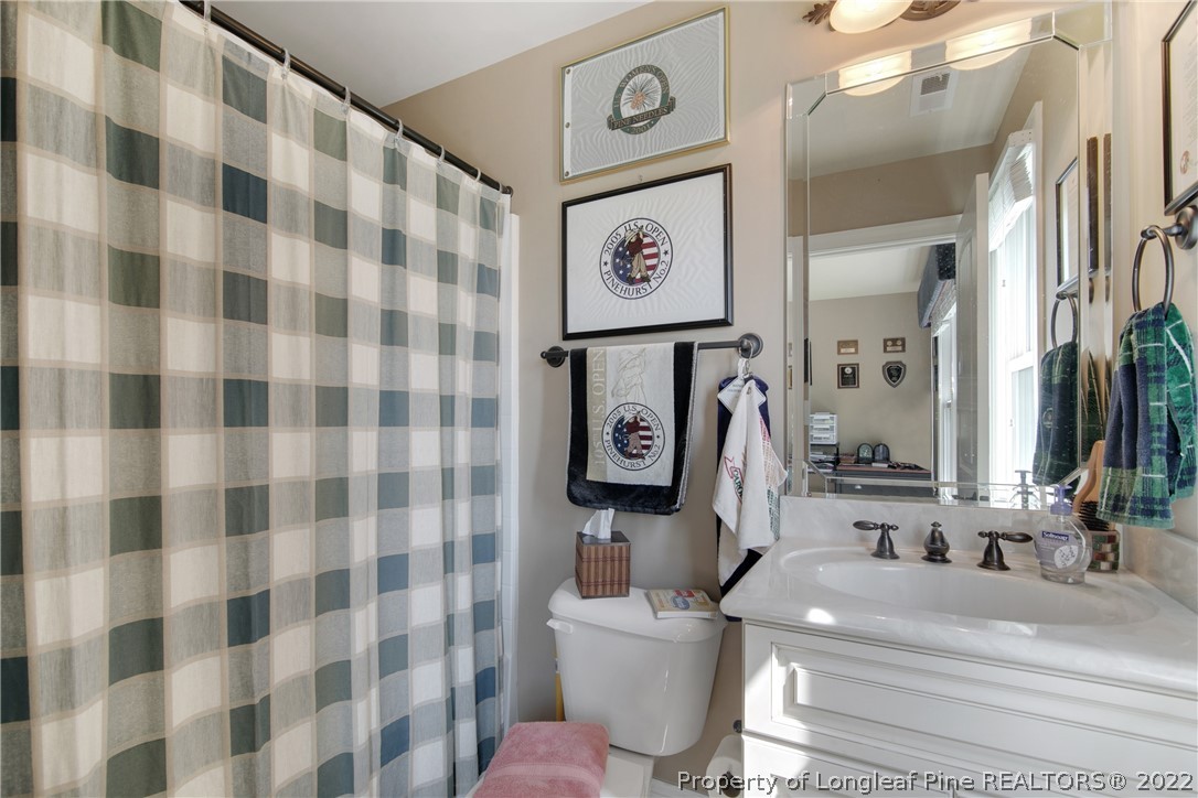 254 Falling Water Road Spring Lake, NC 28390 - Photo 27 of 35 a bathroom with a sink toilet and shower