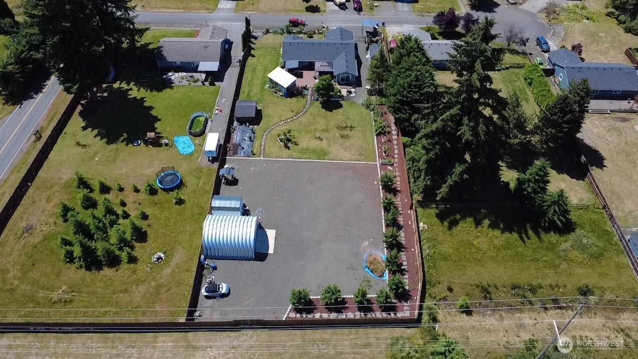 5922 184th Lane Southwest Rochester, WA 98579 - Photo 30 of 34 an aerial view of residential houses with outdoor space