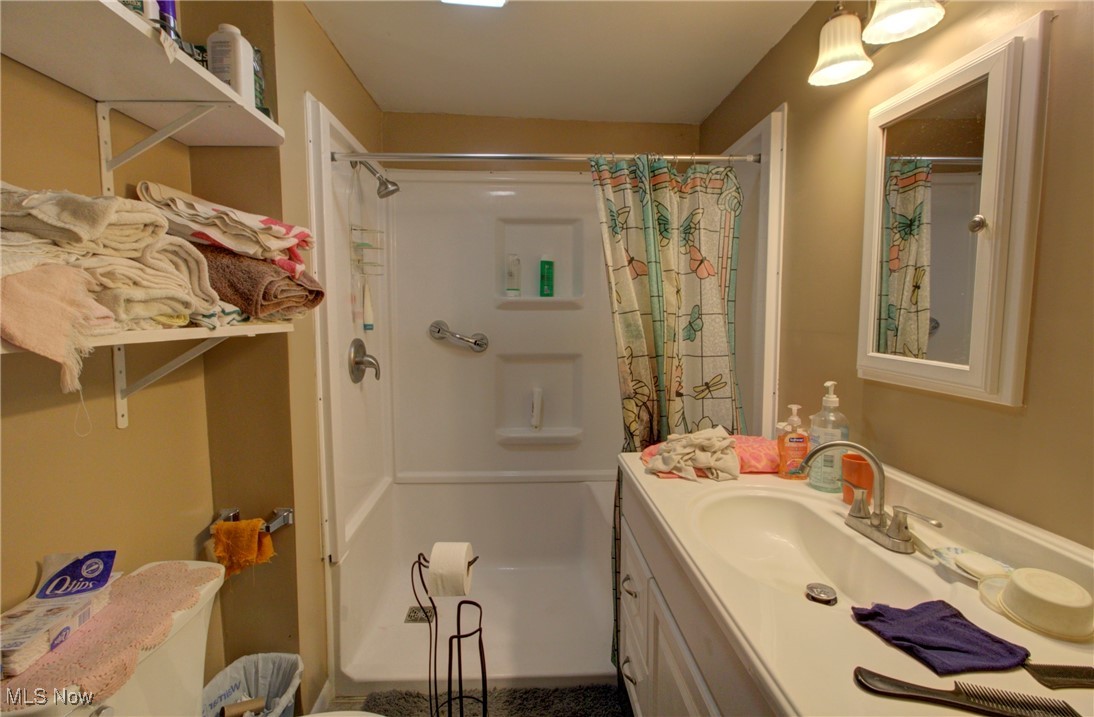 3227 Derussey Road Collins, OH 44826 - Photo 6 of 28 Bathroom featuring vanity and shower / bath combo