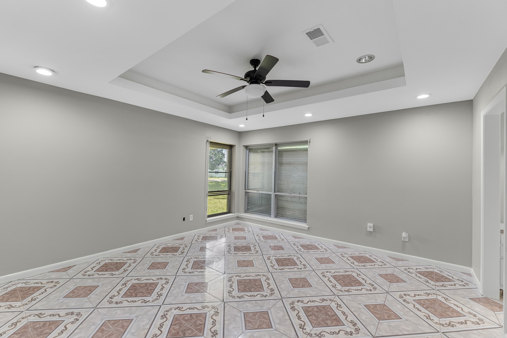 1109 Becker Street Channelview, TX 77530 - Photo 19 of 43 a view of a livingroom with a chandelier fan and windows
