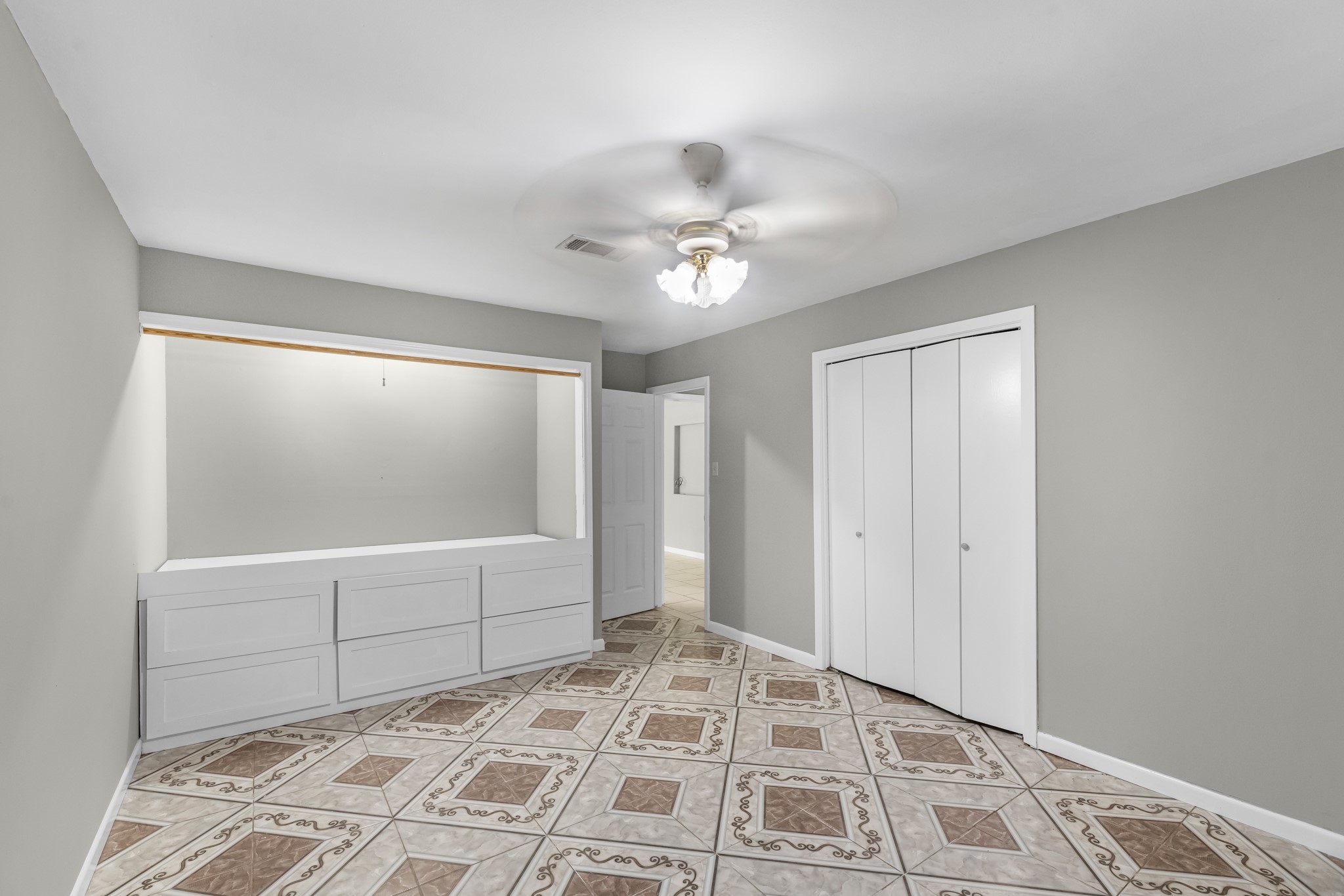 1109 Becker Street Channelview, TX 77530 - Photo 25 of 43 a view of a bedroom with cabinet and windows