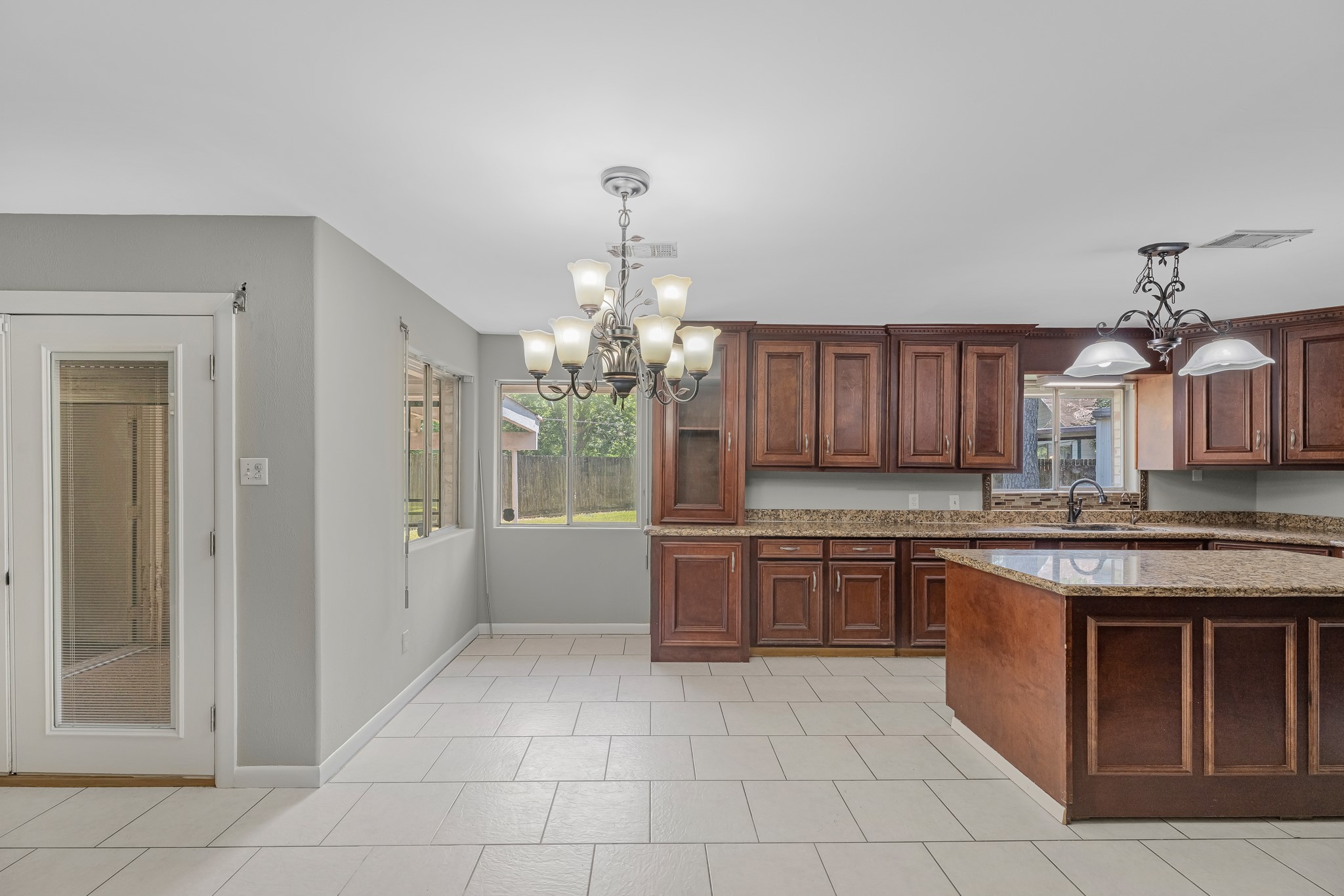 1109 Becker Street Channelview, TX 77530 - Photo 10 of 43 a large kitchen with cabinets and wooden floor