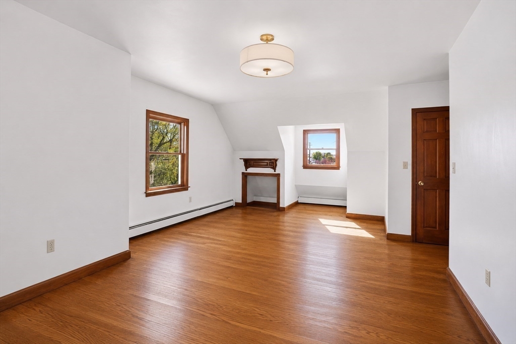 67 Wituwamat Road Weymouth, MA 02191 - Photo 29 of 42 an empty room with wooden floor and window