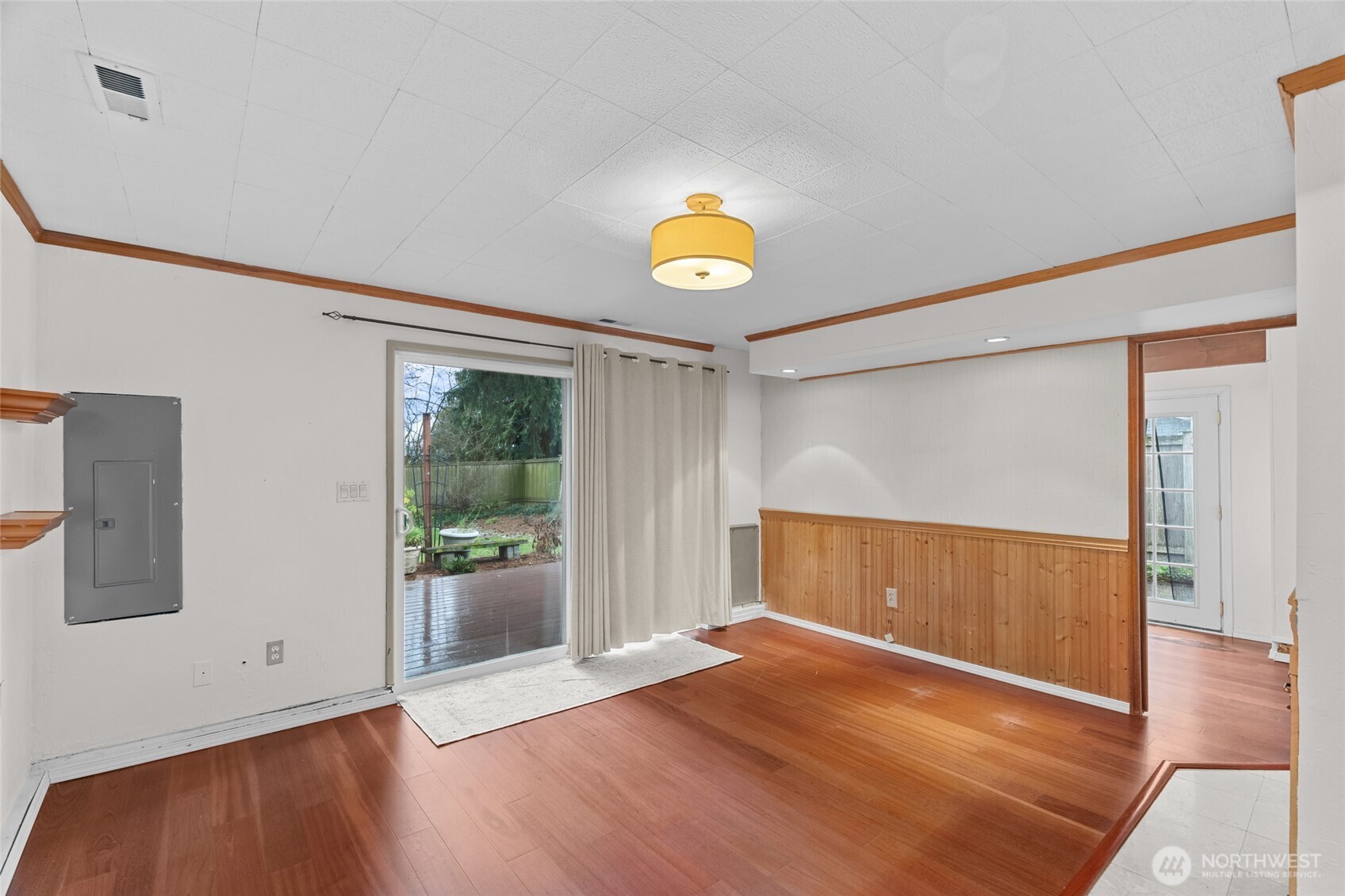 1306 Southwest 160th Street Burien, WA 98166 - Photo 11 of 29 a view of an empty room with wooden floor and a window