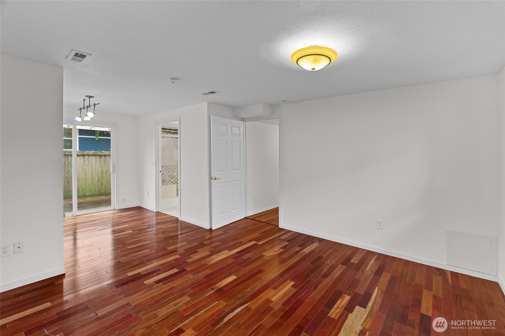 1306 Southwest 160th Street Burien, WA 98166 - Photo 15 of 29 a view of an empty room and wooden floor
