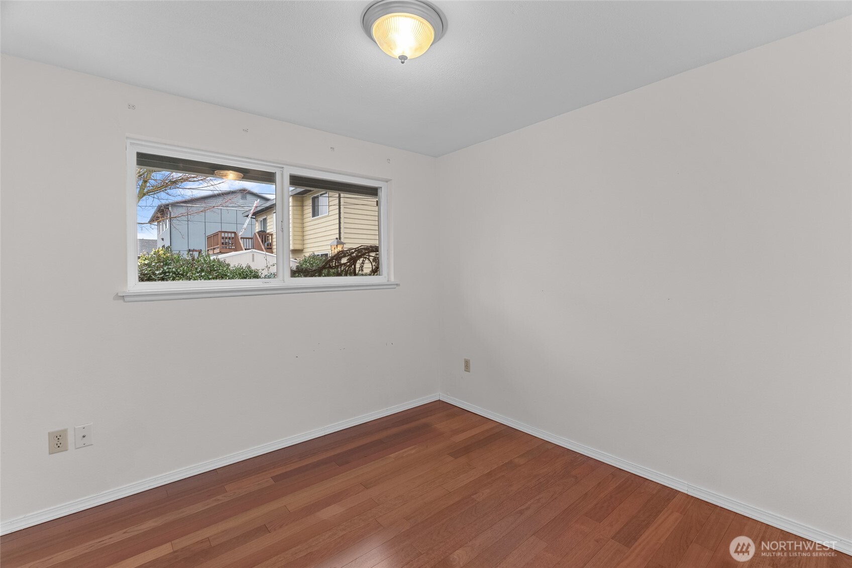 1306 Southwest 160th Street Burien, WA 98166 - Photo 19 of 29 a view of empty room with wooden floor