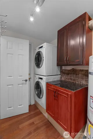 a kitchen with a refrigerator and cabinets