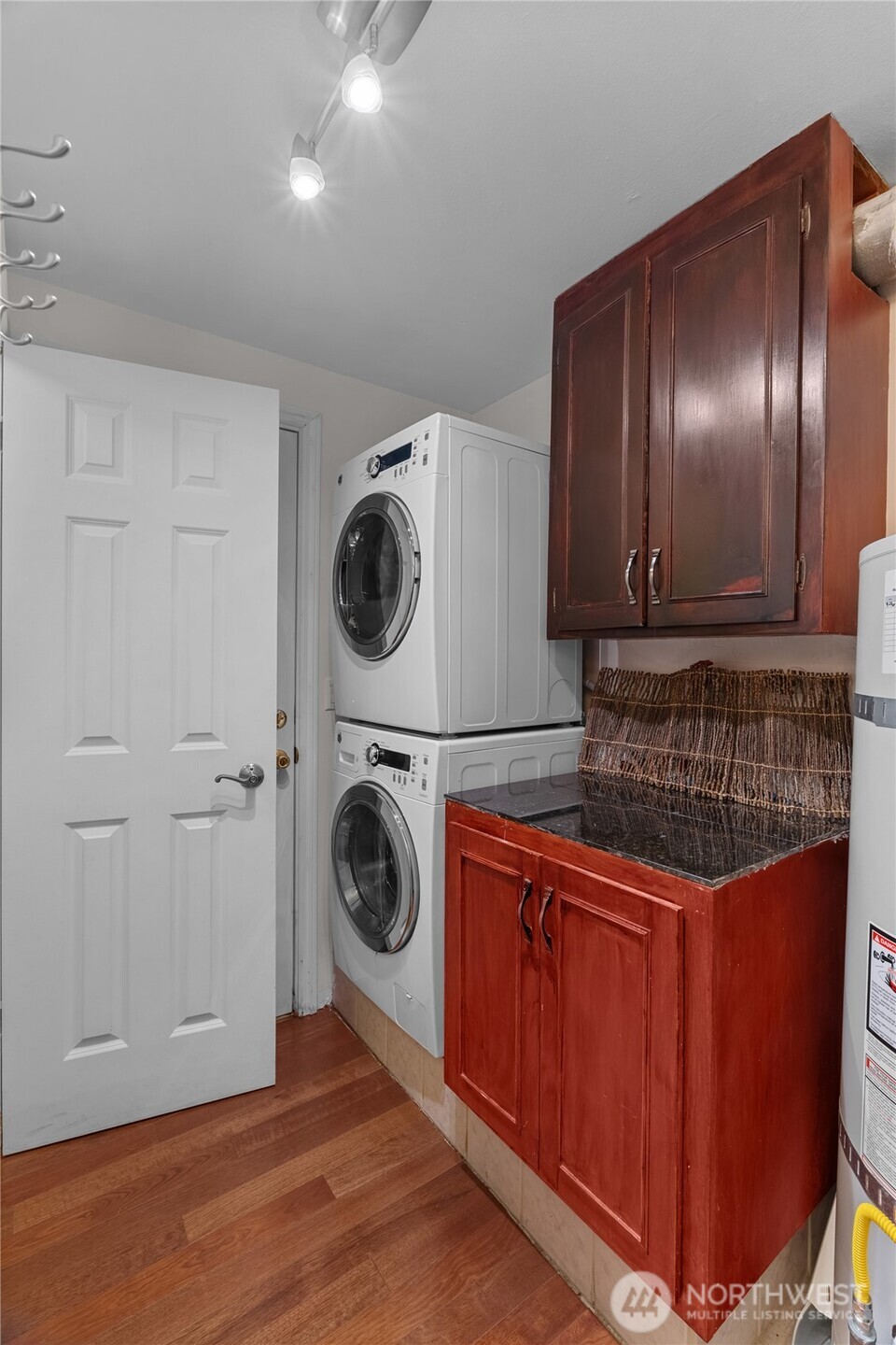 1306 Southwest 160th Street Burien, WA 98166 - Photo 21 of 29 a kitchen with a refrigerator and cabinets