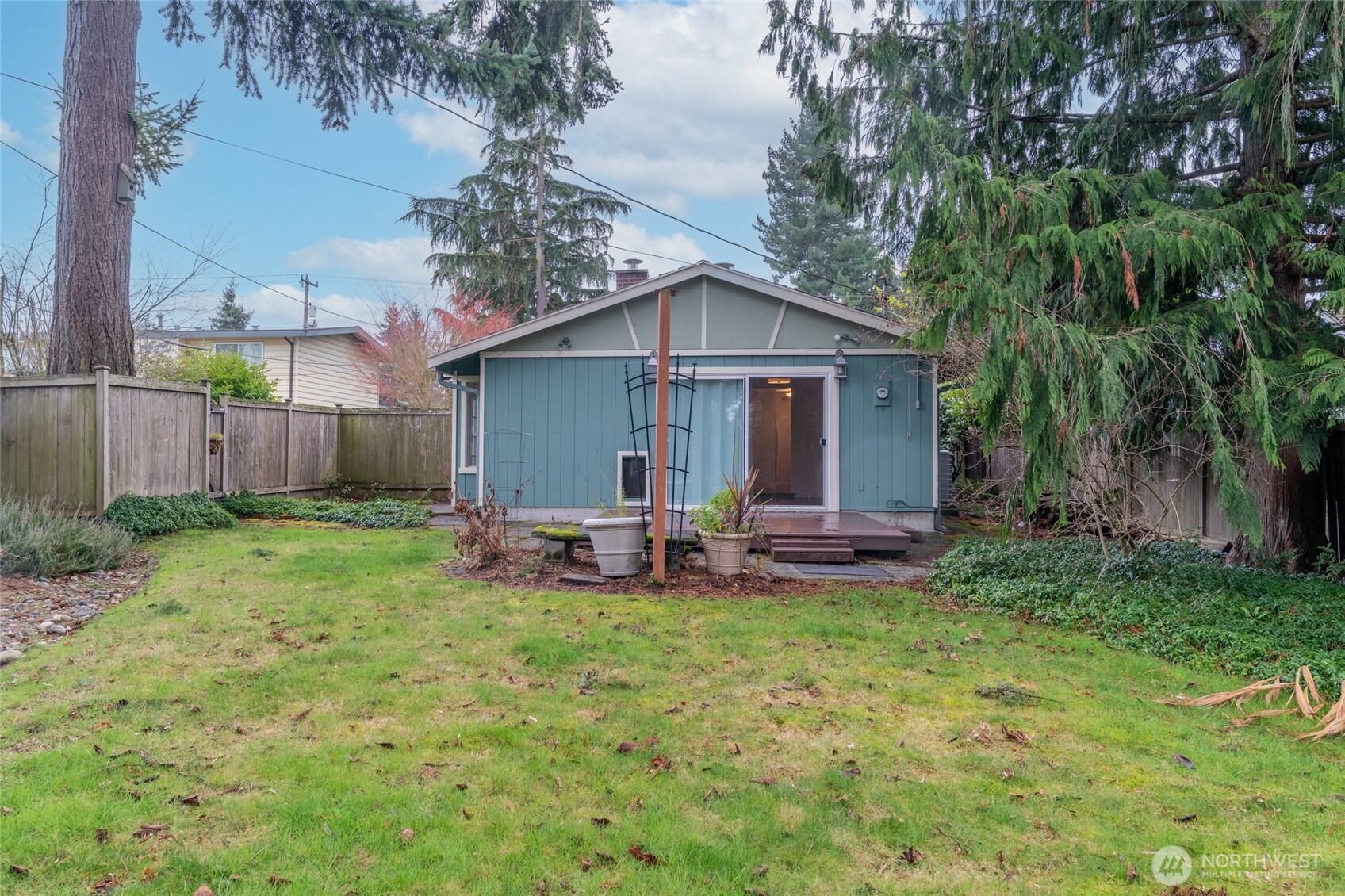1306 Southwest 160th Street Burien, WA 98166 - Photo 22 of 29 a view of a house with a yard and sitting area