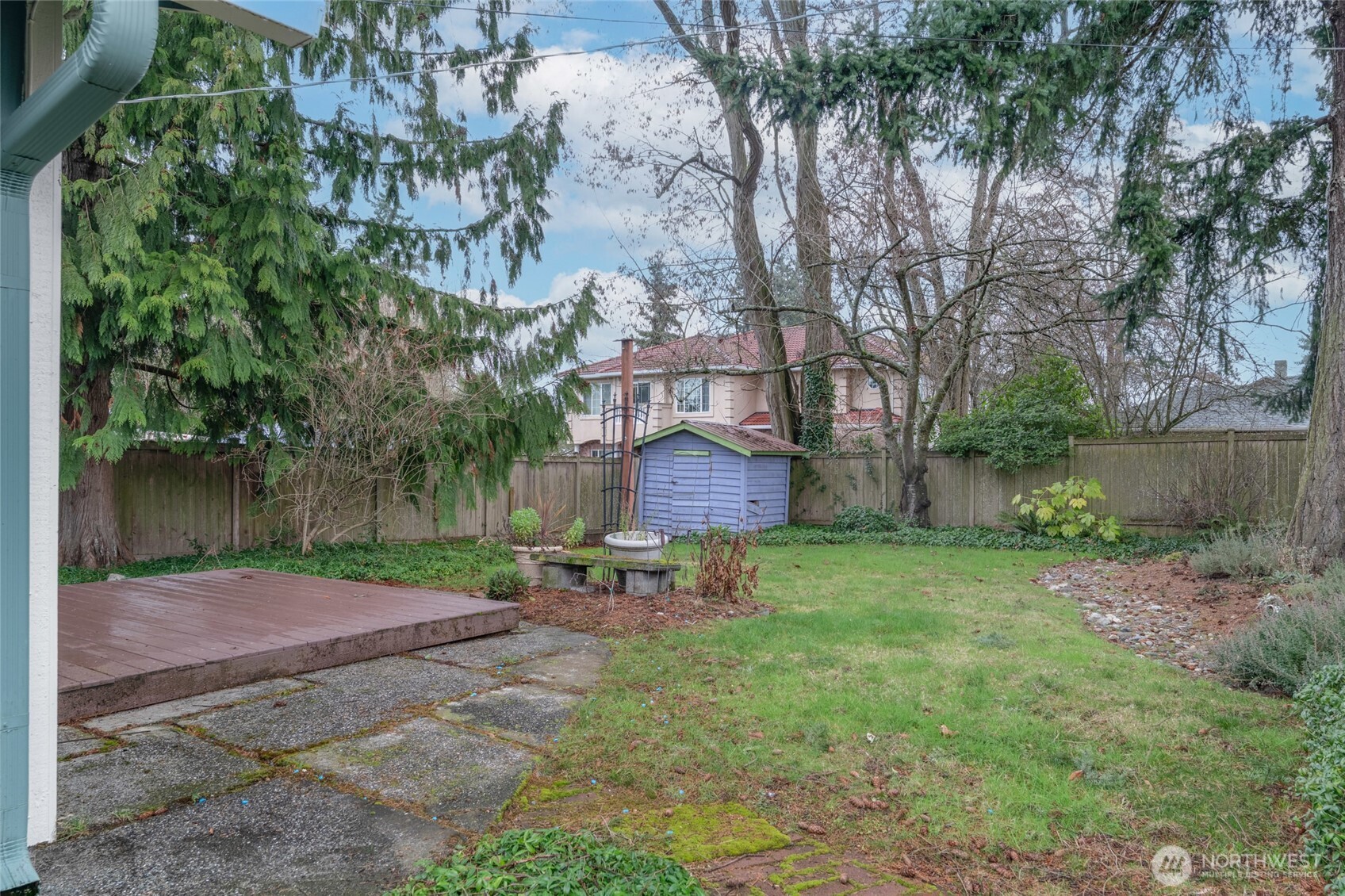 1306 Southwest 160th Street Burien, WA 98166 - Photo 23 of 29 a backyard of a house with table and chairs