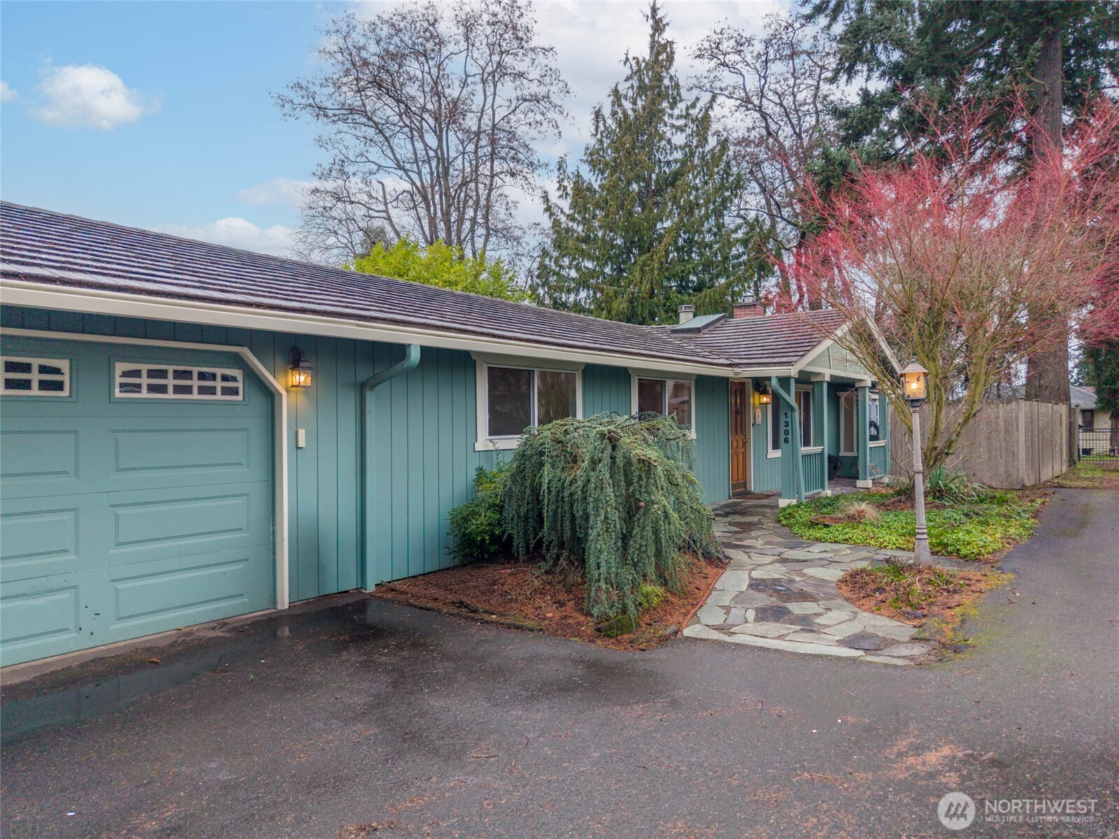 1306 Southwest 160th Street Burien, WA 98166 - Photo 28 of 29 a view of a house with a yard and garage
