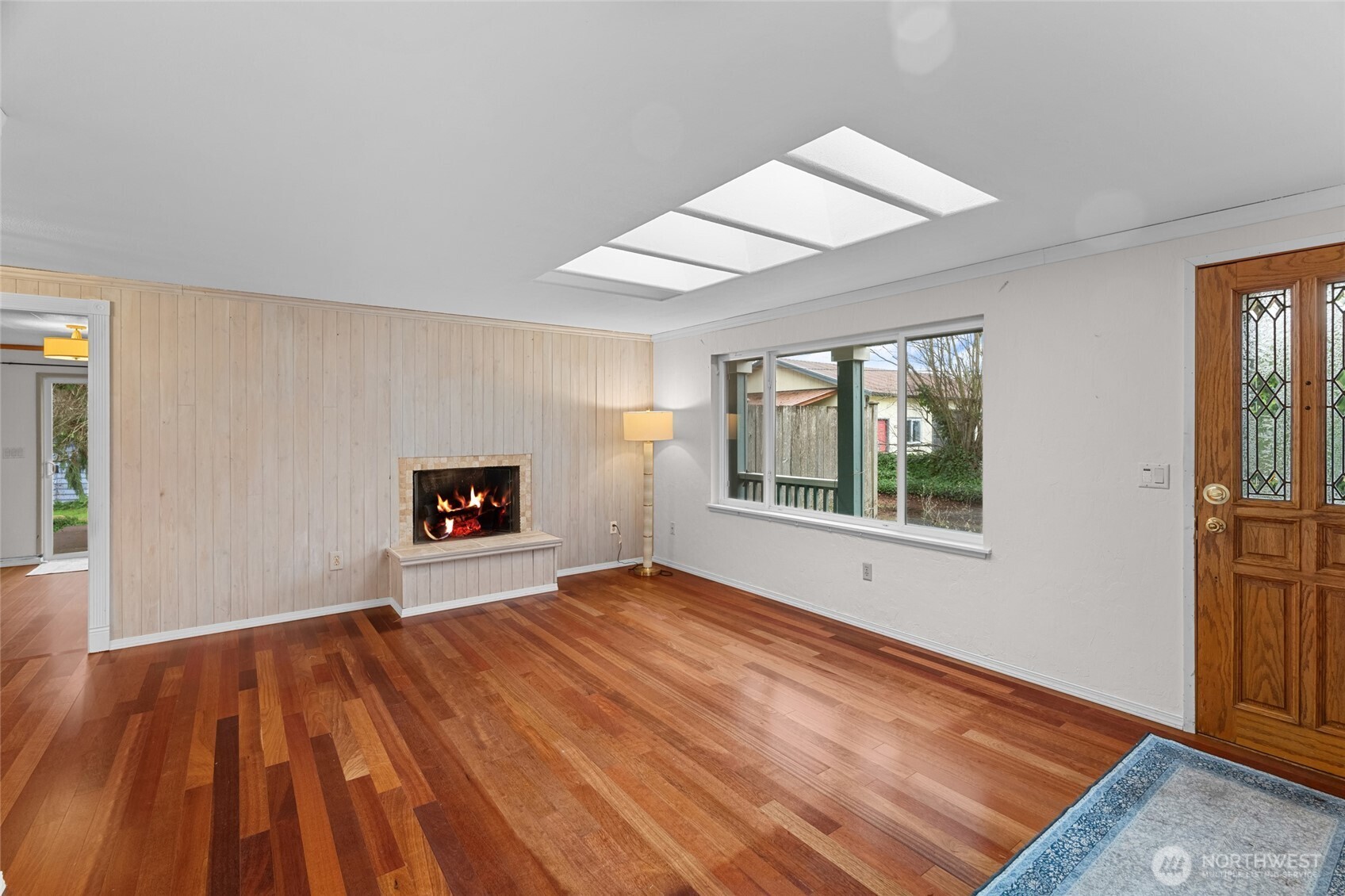 1306 Southwest 160th Street Burien, WA 98166 - Photo 5 of 29 a view of an empty room with a window and wooden floor