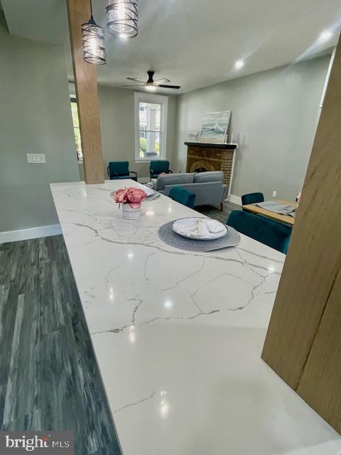 4041 West Cold Spring Lane Baltimore, MD 21215 - Photo 12 of 37 a living room with furniture and a fireplace