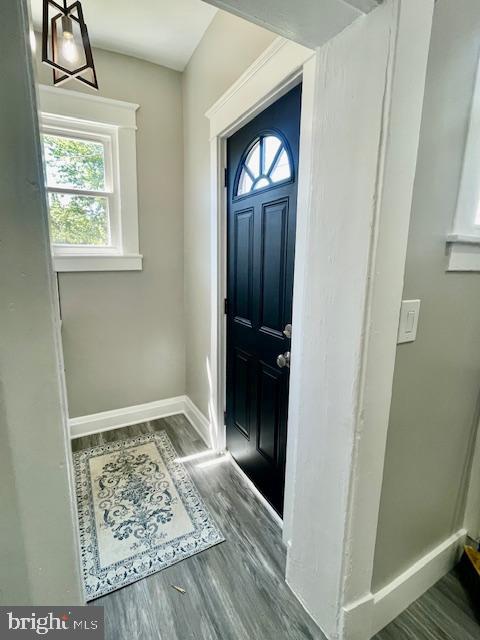 4041 West Cold Spring Lane Baltimore, MD 21215 - Photo 14 of 37 a view of hallway with window and wooden floor