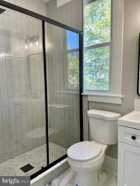 4041 West Cold Spring Lane Baltimore, MD 21215 - Photo 20 of 37 a bathroom with a shower and a toilet