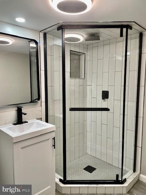 4041 West Cold Spring Lane Baltimore, MD 21215 - Photo 29 of 37 a bathroom with a shower a sink and a mirror