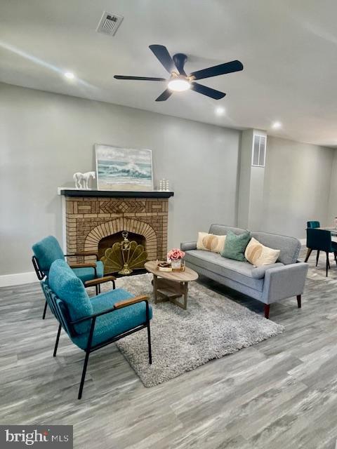4041 West Cold Spring Lane Baltimore, MD 21215 - Photo 4 of 37 a living room with furniture and a fireplace