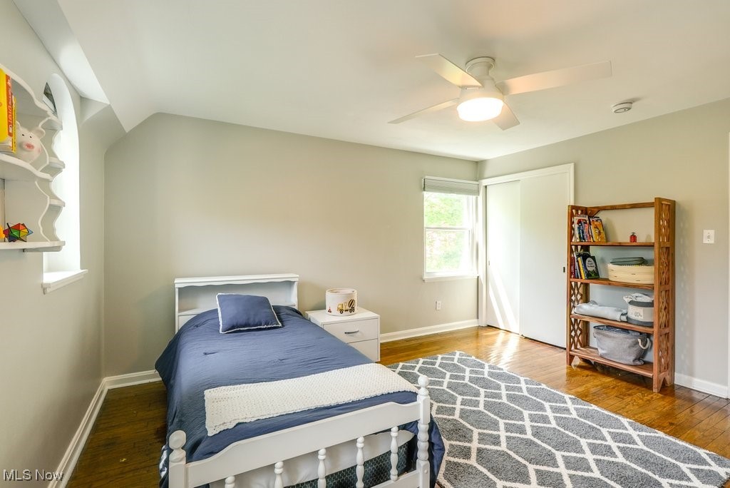 2340 Canterbury Road University Heights, OH 44118 - Photo 18 of 29 Bedroom with baseboards, a ceiling fan, a closet, and wood finished floors