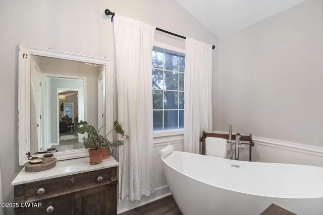 a bed room with a bed and a window