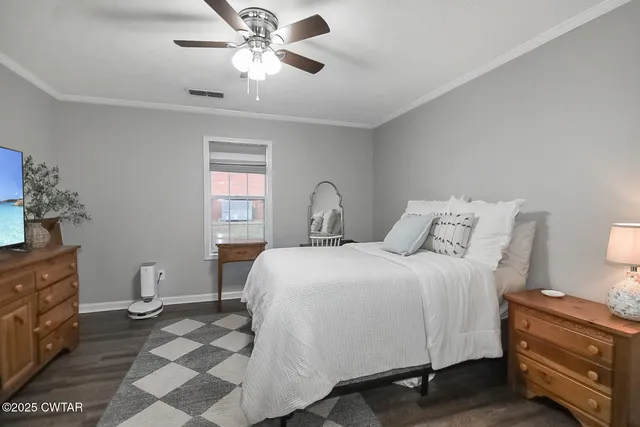 a bathroom with a sink a toilet a mirror and shower