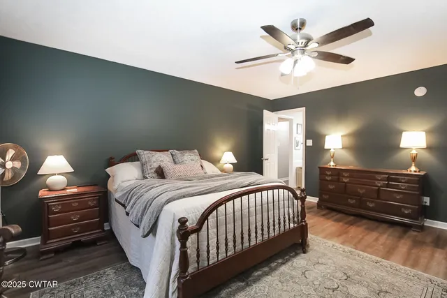 a bathroom with a bathtub a sink and a window