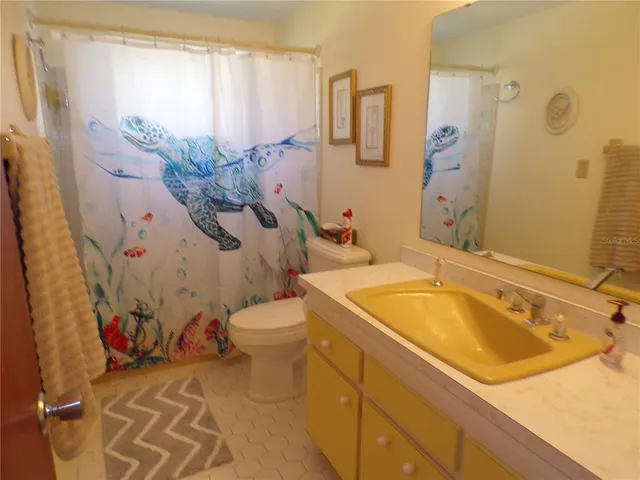 a bathroom with a sink and toilet