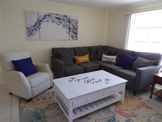 a living room with a couch and a table