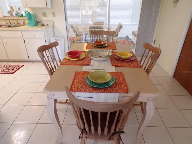 a outdoor dining space with furniture and outdoor view