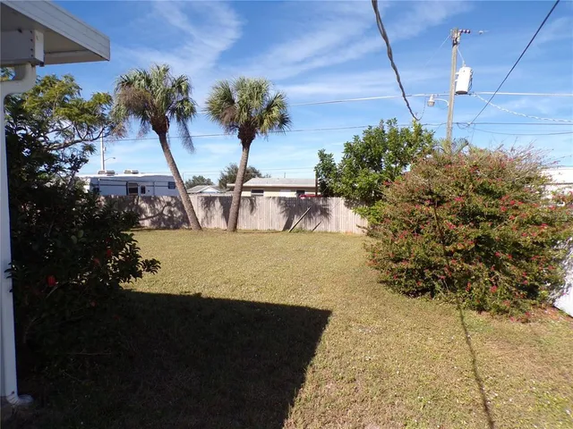 a view of a swimming pool with a yard