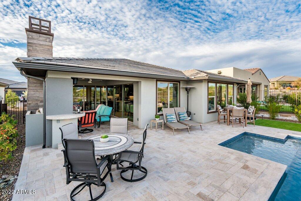 17860 East Cindercone Road Rio Verde, AZ 85263 - Photo 40 of 60 a view of a dinning table and chairs in patio of the house