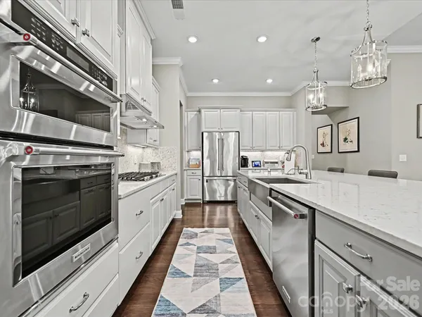 a large kitchen with a stove top oven