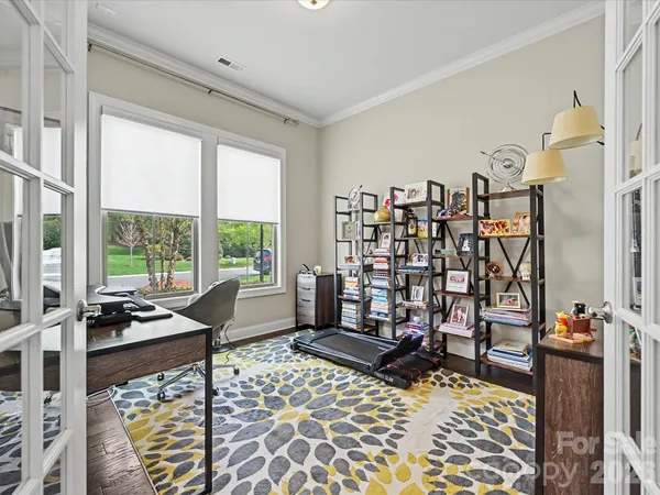 a bedroom with furniture and a window