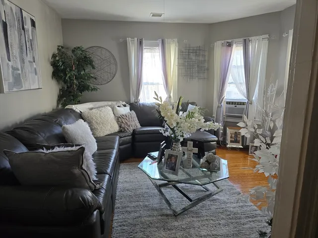 a living room with furniture and a table