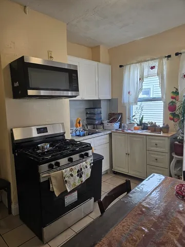 a kitchen with a stove and a sink