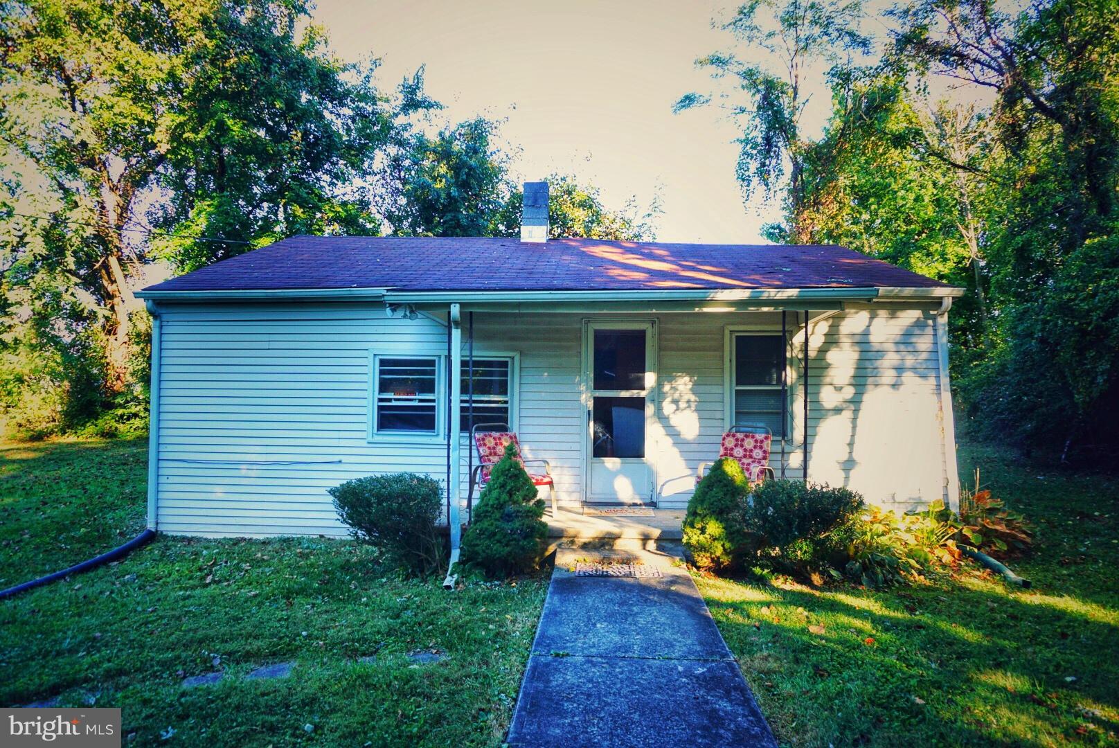 1812 Conowingo Road Forest Hill, MD 21050 - Photo 20 of 21 a view of a house with a yard potted plants and a table