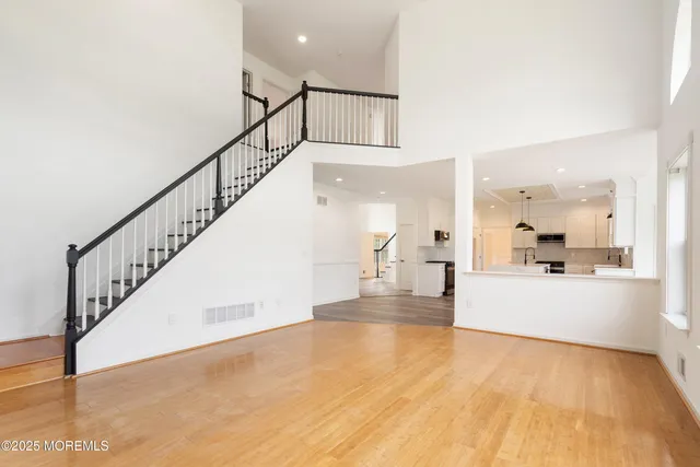 a bathroom with a sink vanity mirror and toilet