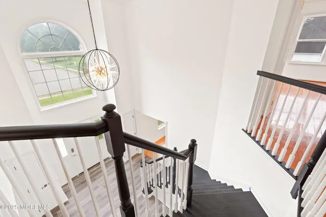 an empty room with furniture and a window